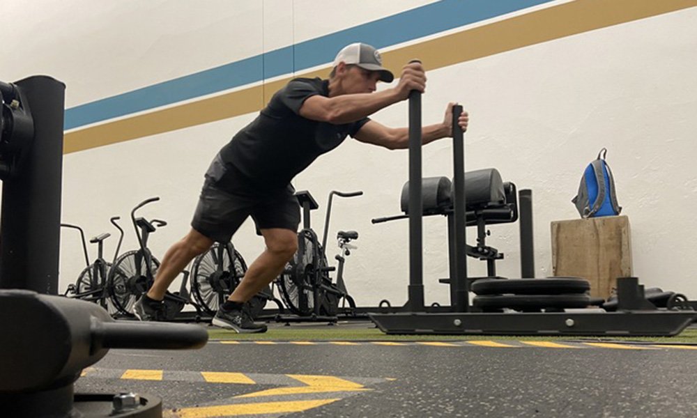 Chiropractor David Noonan is shown working out after successful spine surgery